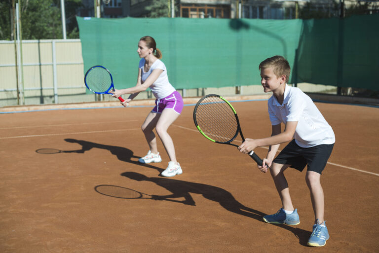 woman kid playing tennis